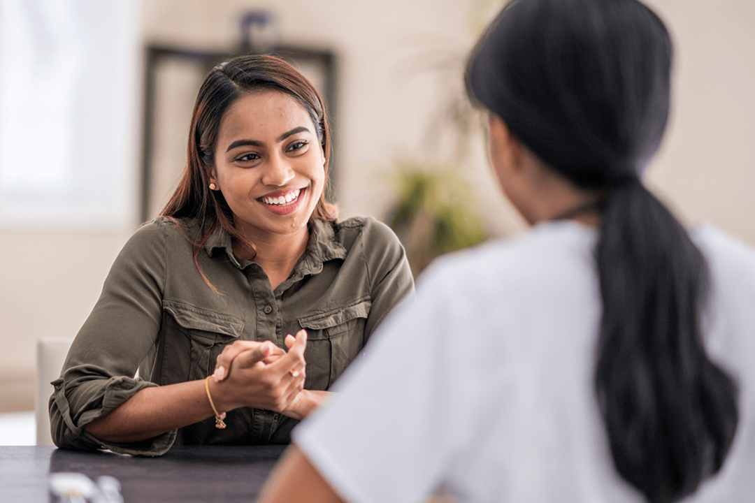 women-smiling-and-talking